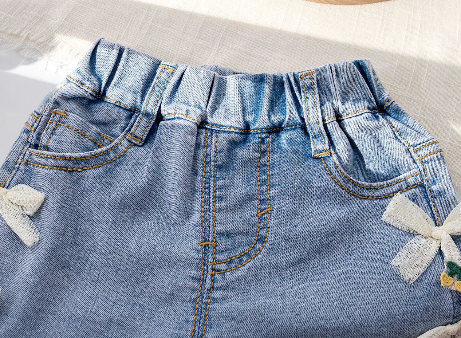 Shorts Infantil Feminino Jeans Lacinhos - BABYLIFEBabyLifeBABYLIFE6 - 12 MesesShorts Infantil Feminino Jeans Lacinhos